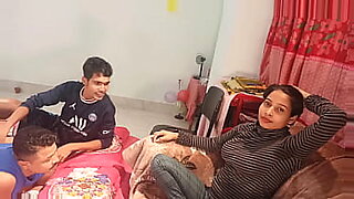 amateur asian chick at home with two guys gets a blowjob